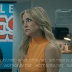 Isla’s orange sleeveless knit top on Running Point