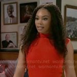Chelsea’s red textured top and pink knit pants with butterfly belt on Beyond the Gates