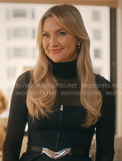 Isla's black zip vest and metal belt on Running Point