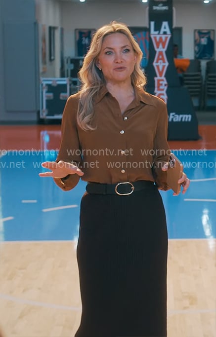 Isla’s brown blouse with gold buttons on Running Point