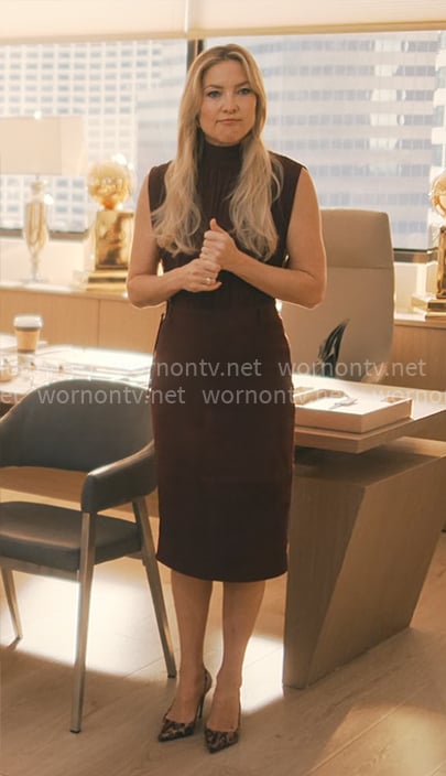 Isla’s burgundy sleeveless blouse and skirt on Running Point