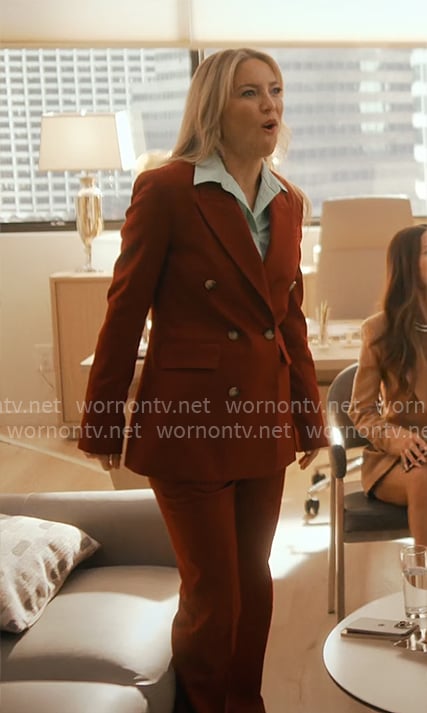 Isla's dark red suit on Running Point