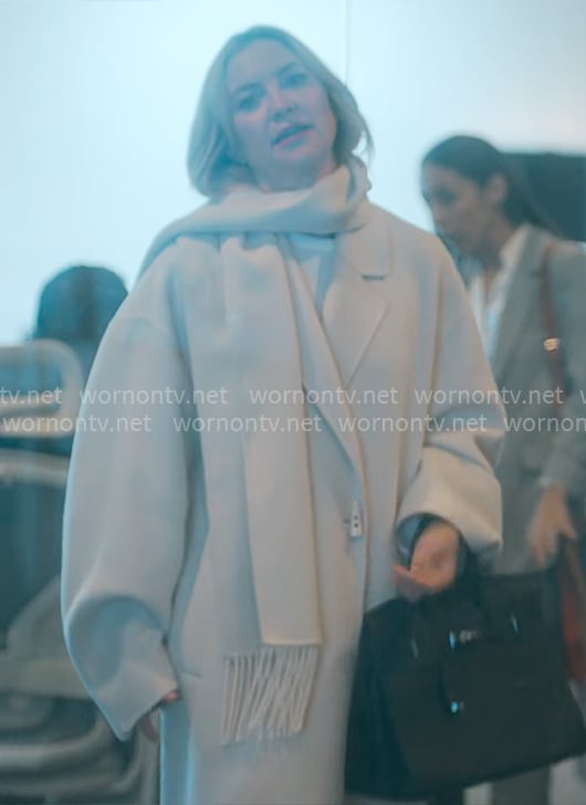 Isla's ivory scarf coat on Running Point