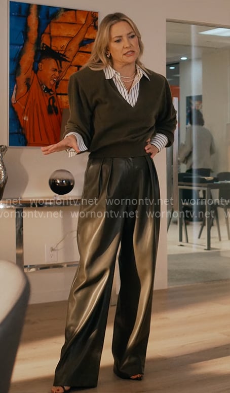 Isla’s olive sweater with shoulder pads and leather pants on Running Point