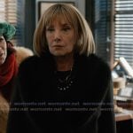 Izzy’s black shearling collar coat on Elsbeth