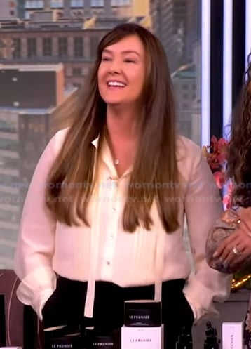 Jacqueline Taylor’s ivory pleated tie neck blouse on The View