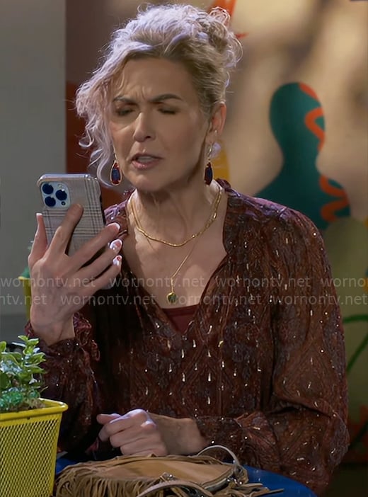 Jan’s red printed blouse and fringed bag on Beyond the Gates