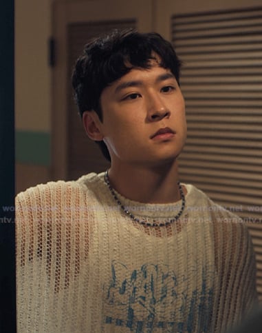 Jin’s white open knit sweater on XO Kitty