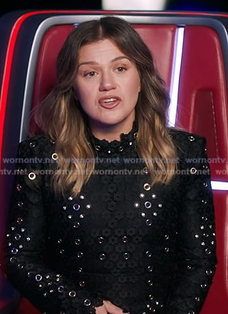 Kelly’s black grommet mini dress on The Voice