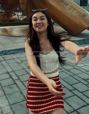 Kitty’s white knit cami and red striped mini skirt on XO Kitty