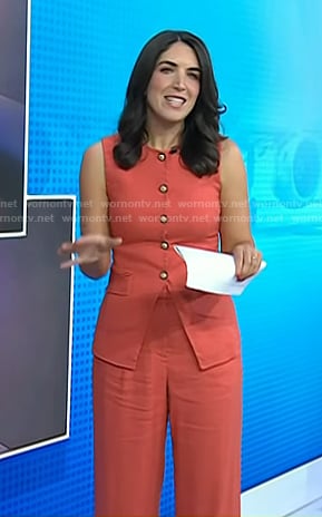 Liz’s orange vest and pants on Today