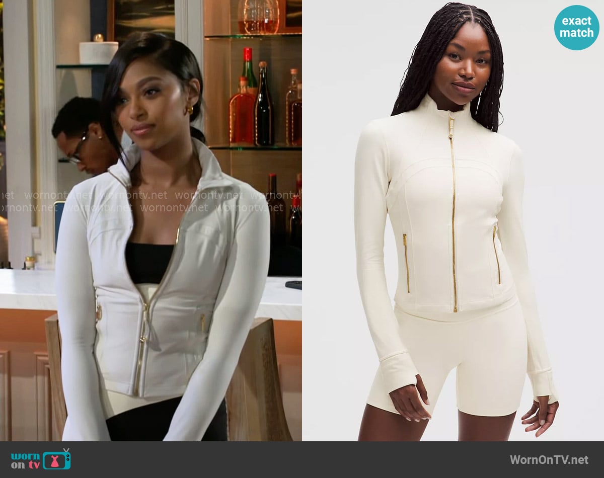 Kat’s white jacket with gold zip on Beyond the Gates