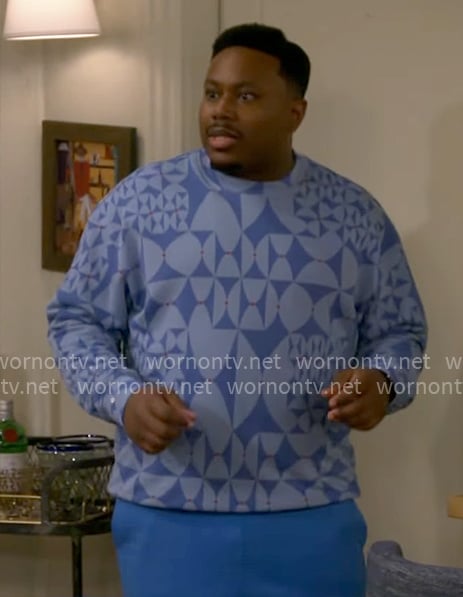 Marty’s blue geometric sweater on The Neighborhood