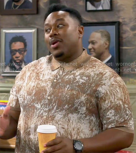 Marty's brown printed polo shirt on The Neighborhood