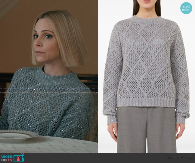 Sloan’s gray cableknit sweater on Elsbeth
