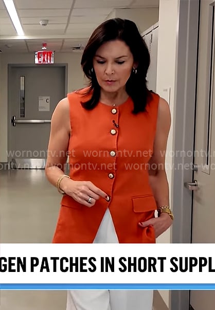 Meg Oliver’s orange vest top on CBS Mornings