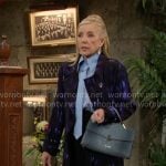 Nikki’s blue tie-neck blouse and printed coat on The Young and the Restless