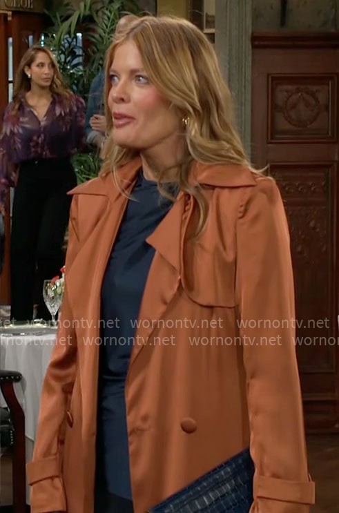 Phyllis's orange silky trench coat on The Young and the Restless