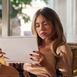 Cassie's pink lace trim robe on Euphoria