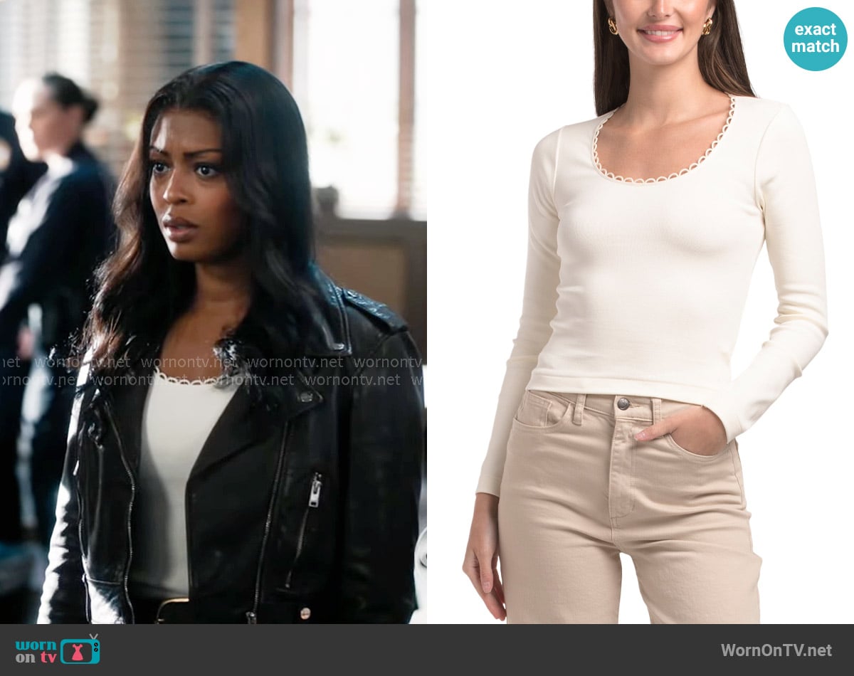 Daphne’s white scalloped top on High Potential