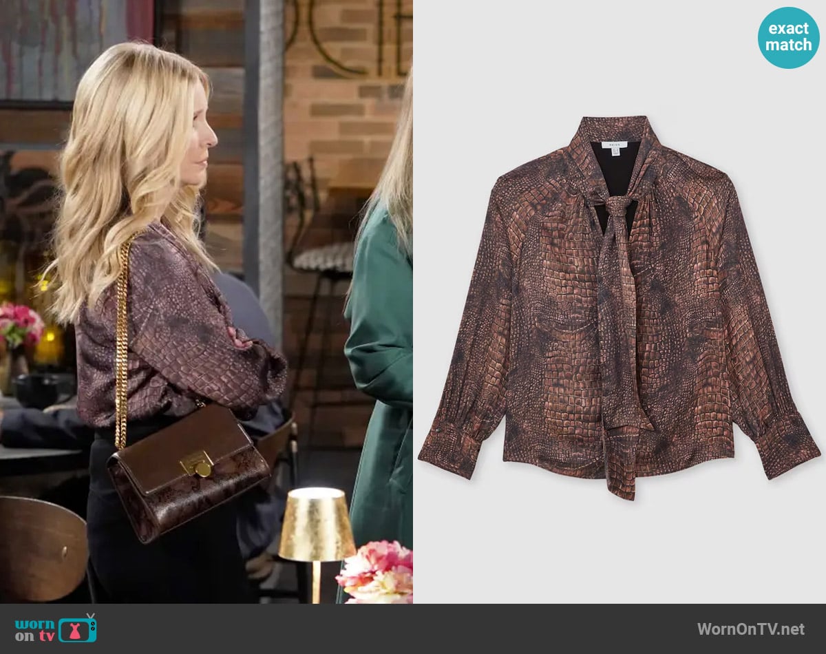Reiss Naomi Crocodile-Print Tie-Neck Blouse worn by Christine Blair Williams (Lauralee Bell) on The Young and the Restless