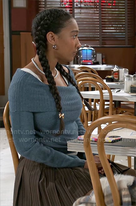 Samantha's blue off-shoulder sweater and brown pleated skirt with duck bag on Beyond the Gates