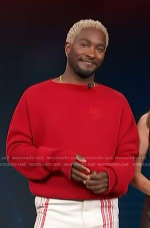Scott’s red logo embroidered sweater on Access Hollywood