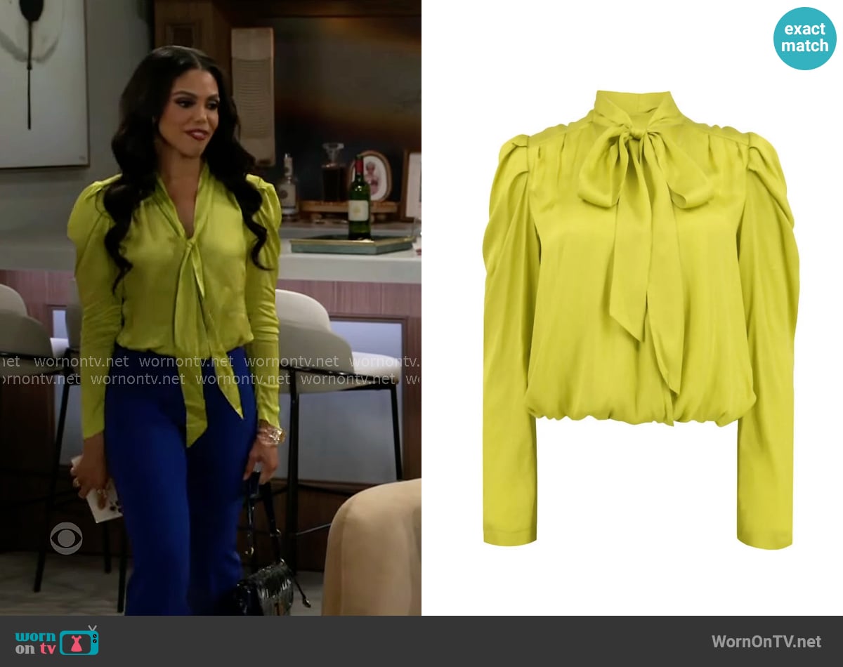 Dani’s lime tie-neck blouse on Beyond the Gates