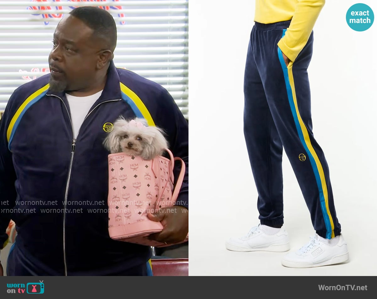 Sergio Tacchini Banda Velour Track Pant in Maritime Blue worn by Calvin (Cedric The Entertainer) on The Neighborhood