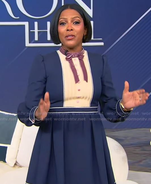 Tamron’s blue tie neck mini dress on Tamron Hall Show