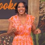 Tamron’s red floral ruffle dress on Tamron Hall Show