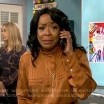 Tina’s orange cargo jumpsuit on The Neighborhood