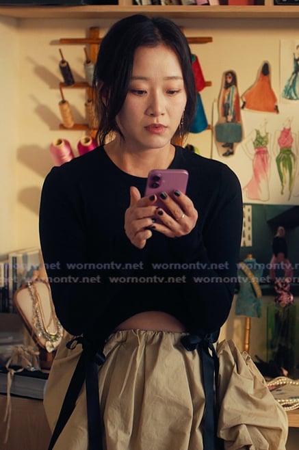 Yuri’s black bow hem top and skirt on XO Kitty