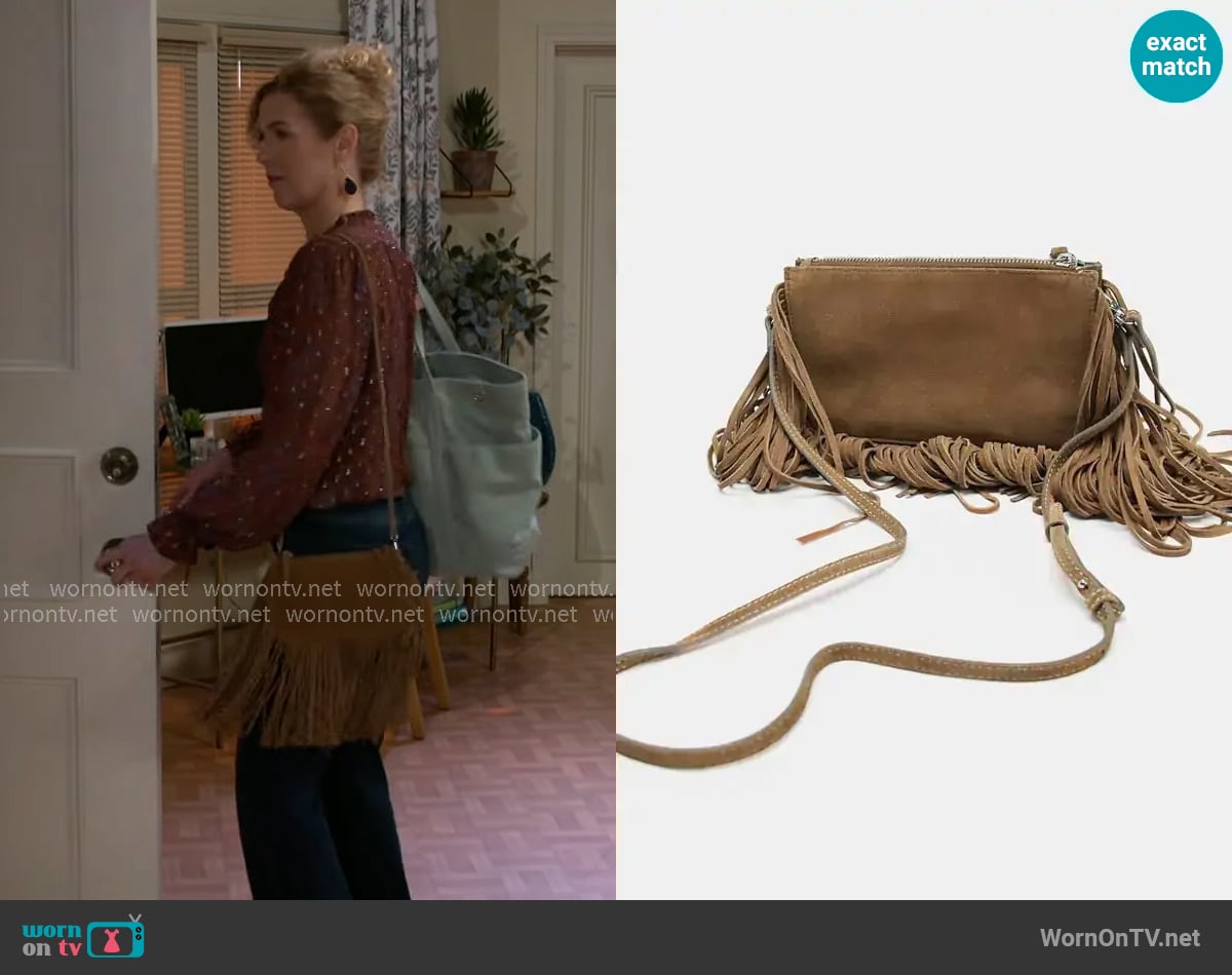 Zara Fringed Split Suede Mini Crossbody Bag worn by Jan Morgan (Jerri Tubbs) on Beyond the Gates
