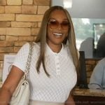 Angela’s white pointelle knit polo on The Real Housewives of Atlanta