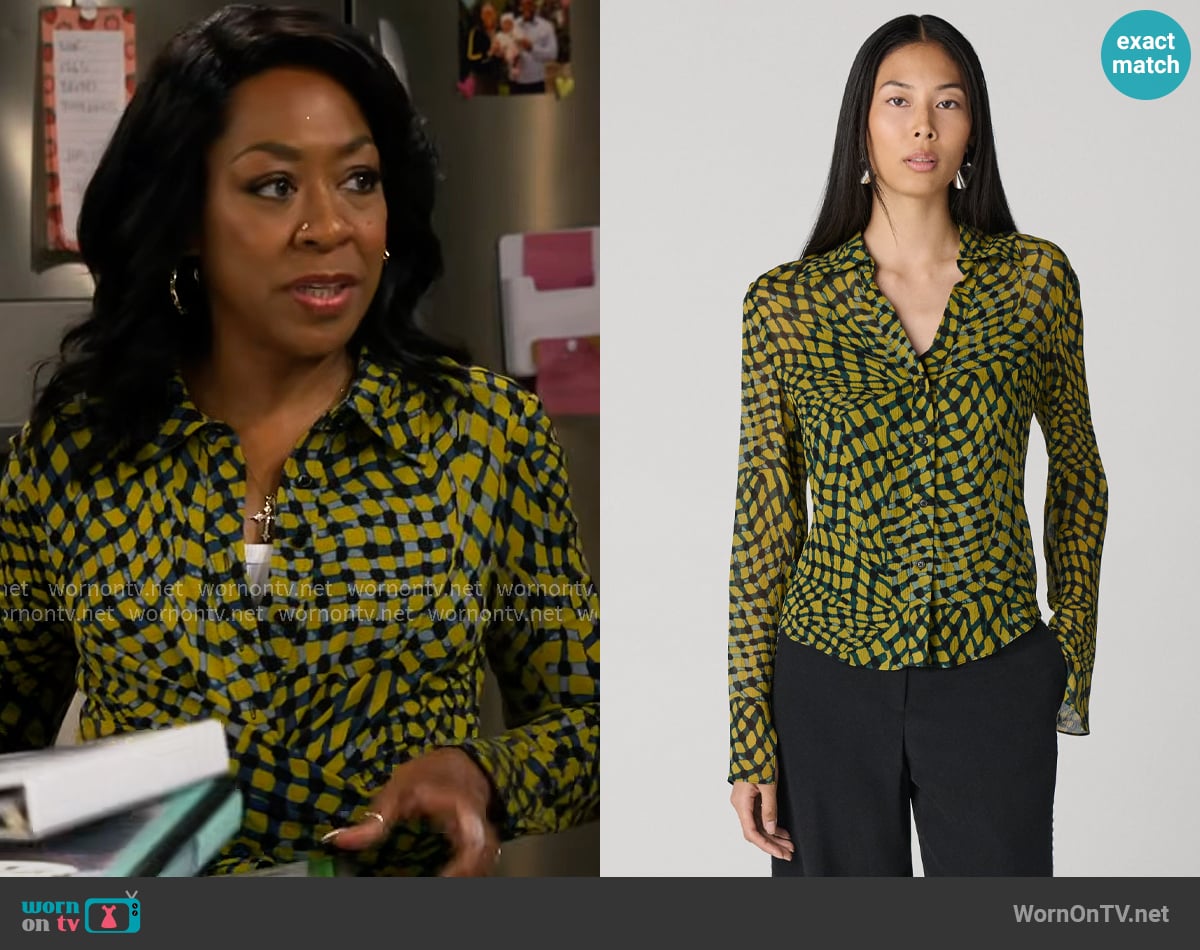 Tina’s yellow printed shirt on The Neighborhood Tina’s yellow printed shirt on The Neighborhood