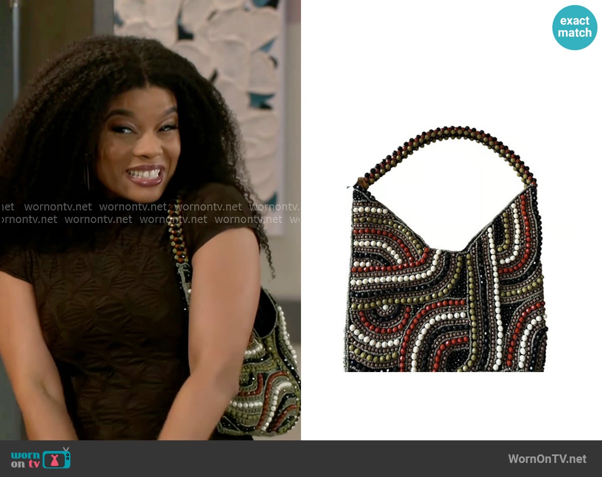 From India To You Beaded Hobo Bag worn by Eva Thomas (Ambyr Michelle) on Beyond the Gates