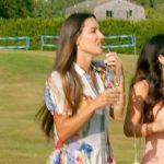 Kelsey’s white floral print mini dress on The Real Housewives of Rhode Island