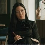 Mallory’s black ruffle neck blouse on Elsbeth