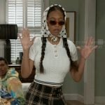 Samantha’s white cable-knit top and plaid skirt on Beyond the Gates