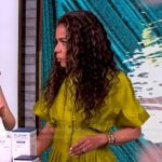 Sunny’s green pleated button down top on The View