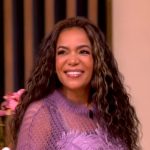 Sunny’s purple open knit feather sweater and ruffle skirt on The View