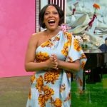 Tamron’s blue floral one shoulder dress on Tamron Hall Show